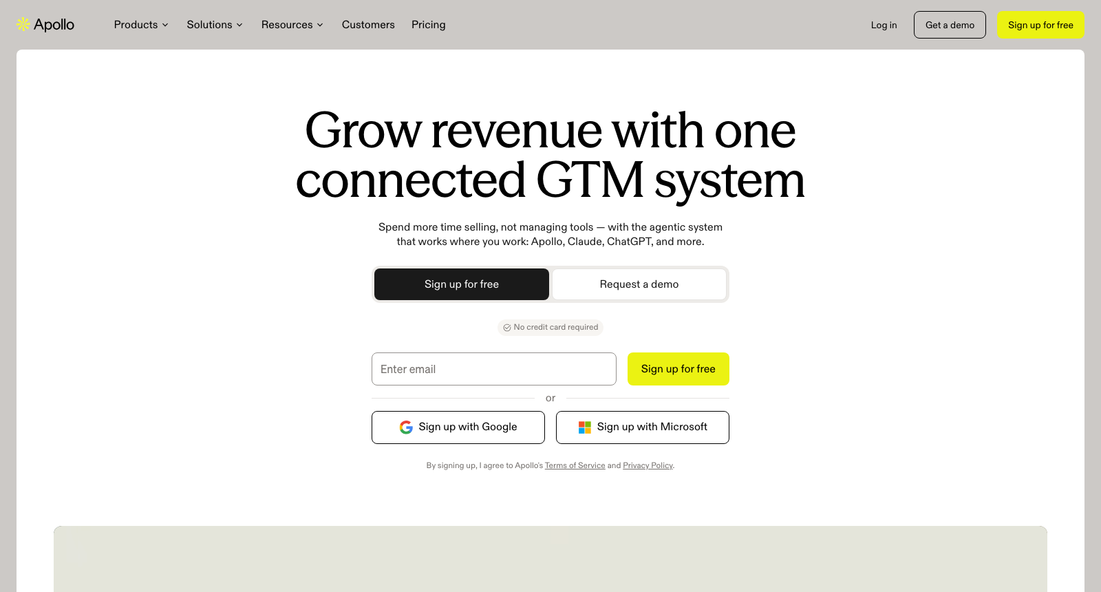 The Apollo homepage, headlined Grow revenue with one connected GTM system, above a work email field and buttons to sign up with Google or Microsoft.